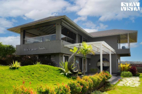 StayVista's The Aquamarine Villa - Igatpuri - Lakeside Retreat with Infinity Pool & Deck, Theatre Room & Gazebo